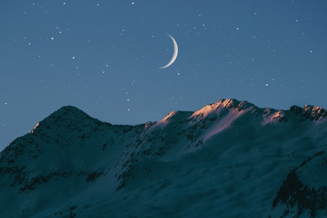 Moon over a mountain landscape during the New Moon in Virgo period